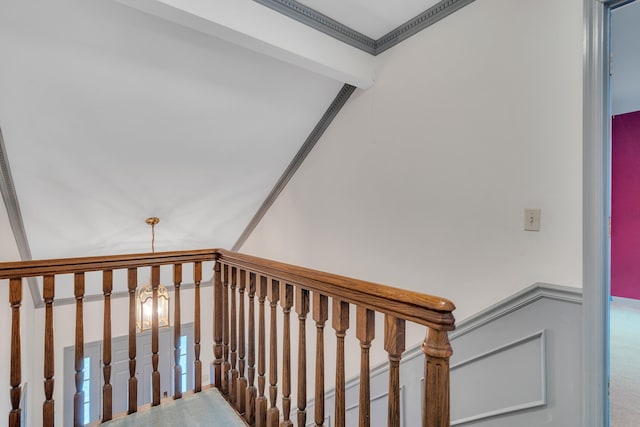 stairway featuring ornamental molding