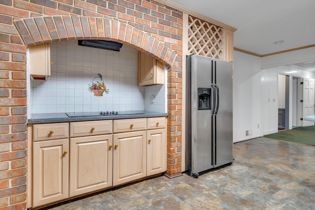 kitchen featuring ornamental molding, backsplash, stainless steel fridge, and black electric cooktop