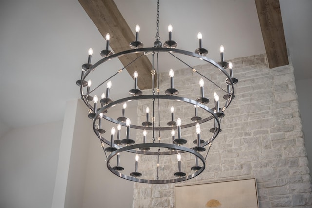 details with beam ceiling and an inviting chandelier