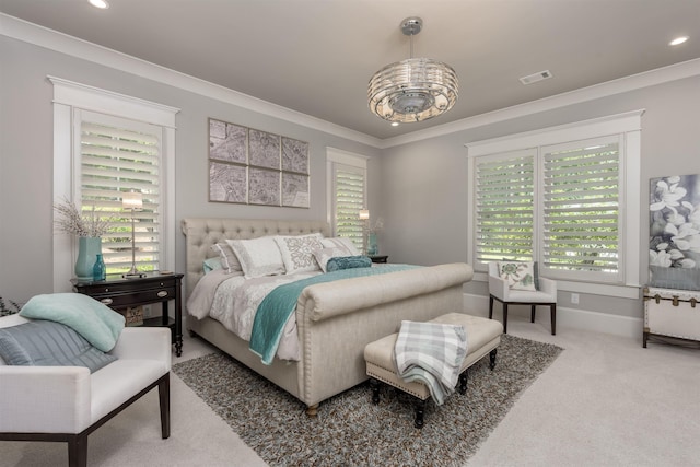 carpeted bedroom featuring multiple windows and ornamental molding