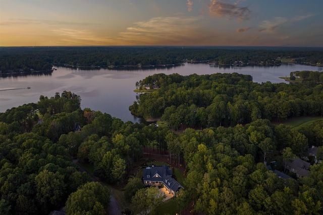 aerial view at dusk with a water view