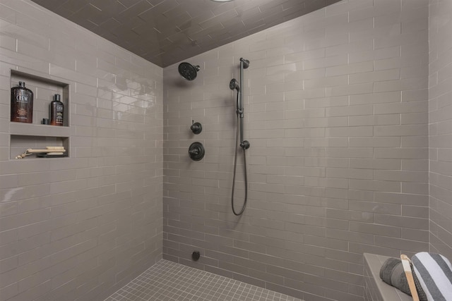 bathroom featuring tiled shower