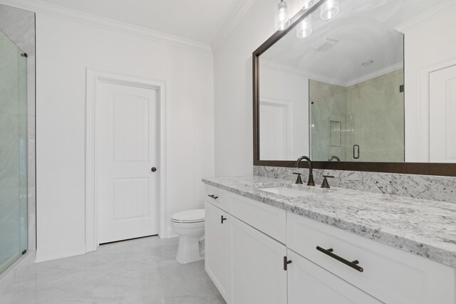 bathroom with crown molding, vanity, toilet, and a shower with door