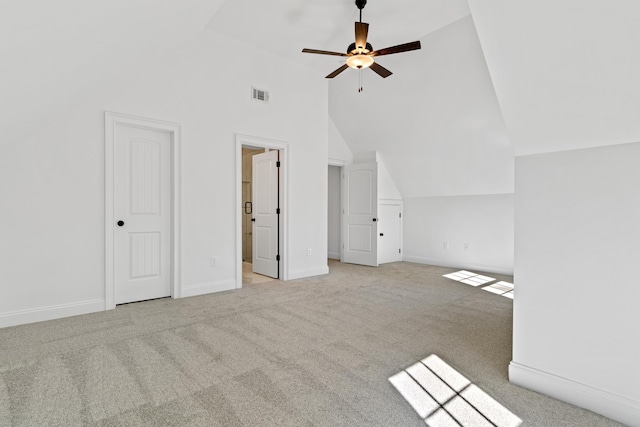 additional living space featuring ceiling fan, light colored carpet, and vaulted ceiling