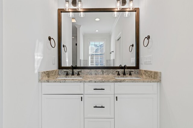 bathroom with vanity and crown molding