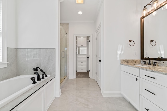 bathroom with vanity, ornamental molding, and shower with separate bathtub