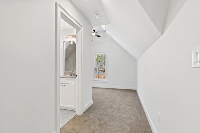 additional living space with lofted ceiling, light colored carpet, and ceiling fan