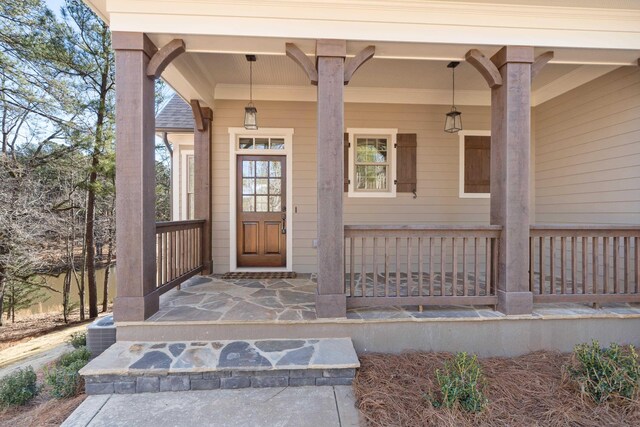 property entrance featuring central AC unit and a porch