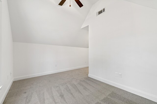 additional living space with lofted ceiling, carpet floors, and ceiling fan