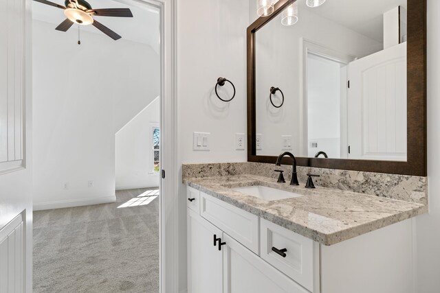 bathroom with ceiling fan and vanity