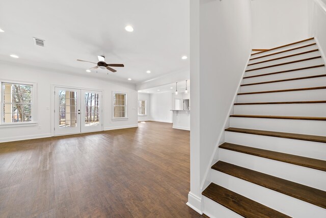 unfurnished living room with french doors, ceiling fan, and dark hardwood / wood-style flooring