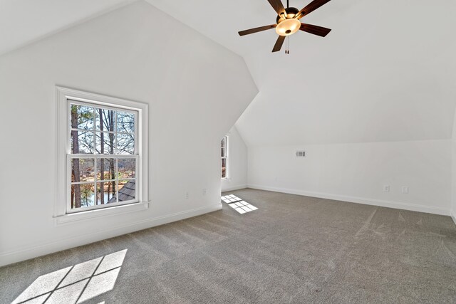 bonus room featuring ceiling fan, light colored carpet, and vaulted ceiling