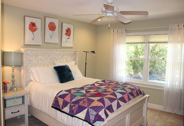 bedroom featuring ceiling fan and carpet flooring