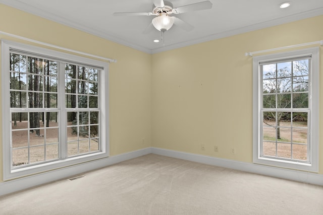 carpeted empty room featuring crown molding and ceiling fan