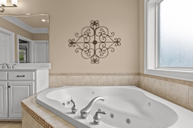 bathroom featuring vanity, tiled tub, and crown molding