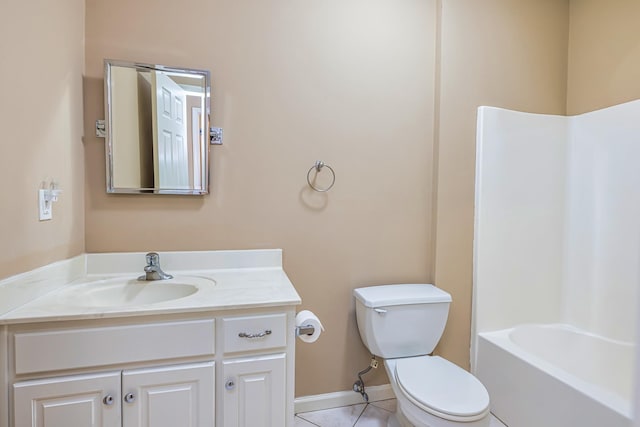 bathroom with vanity, tile patterned flooring, and toilet