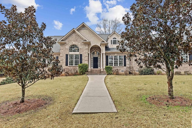 view of front of home with a front lawn