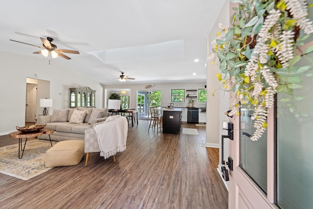 living room featuring a ceiling fan, baseboards, recessed lighting, and dark wood-type flooring