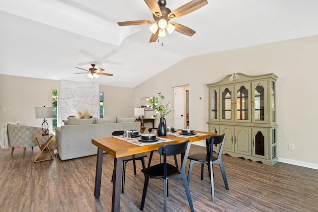 dining space featuring baseboards, vaulted ceiling, wood finished floors, and ceiling fan