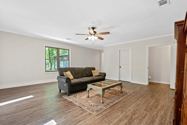 living area with dark wood-style flooring, a ceiling fan, visible vents, and baseboards