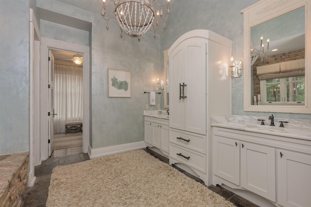 bathroom with vanity and a notable chandelier