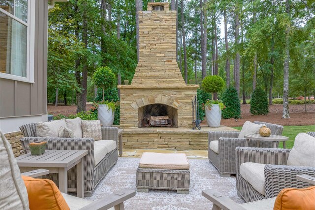 view of patio featuring an outdoor living space with a fireplace