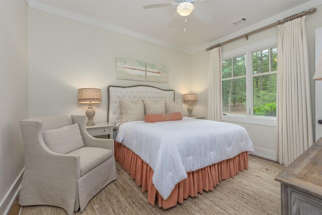 bedroom featuring crown molding and ceiling fan