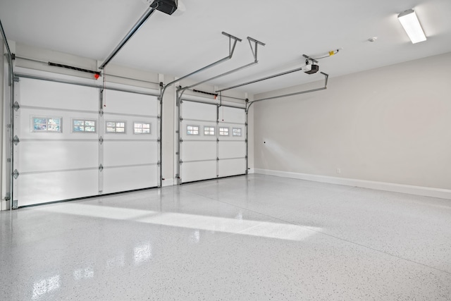 1101 Brookside, Greensboro, GA 30642 - garage featuring baseboards and a garage door opener
