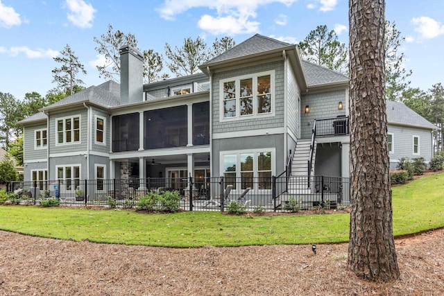 1101 Brookside, Greensboro, GA 30642 - back of house featuring a chimney, a sunroom, stairway, fence, and a patio area