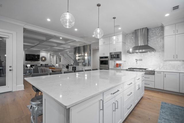1101 Brookside, Greensboro, GA 30642 - kitchen with light wood-type flooring, visible vents, stainless steel appliances, and wall chimney exhaust hood