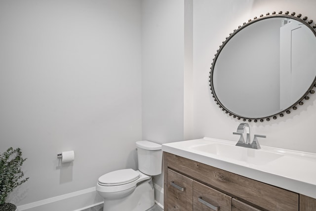 1101 Brookside, Greensboro, GA 30642 - bathroom featuring toilet, vanity, and baseboards