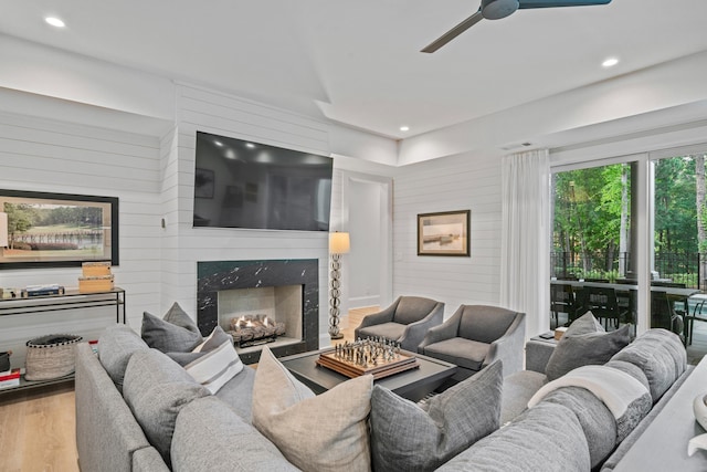 1101 Brookside, Greensboro, GA 30642 - living room featuring wood finished floors, a premium fireplace, visible vents, ceiling fan, and recessed lighting