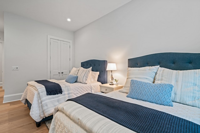 1101 Brookside, Greensboro, GA 30642 - bedroom with baseboards, a closet, wood finished floors, and recessed lighting