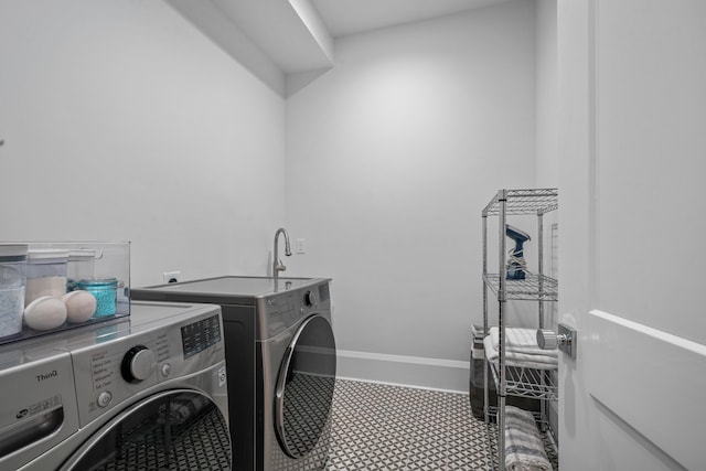 1101 Brookside, Greensboro, GA 30642 - washroom with baseboards, washer and dryer, and laundry area