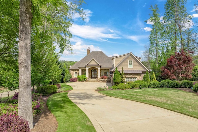 1071 Palmers Vw, Greensboro, GA 30642 - craftsman house with a chimney, a front lawn, driveway, and stone siding