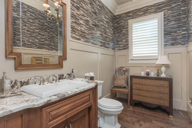 1071 Palmers Vw, Greensboro, GA 30642 - bathroom with a decorative wall, crown molding, wood finished floors, vanity, and toilet