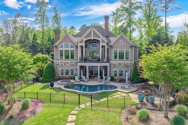 1071 Palmers Vw, Greensboro, GA 30642 - back of property featuring a lawn, stone siding, and a balcony