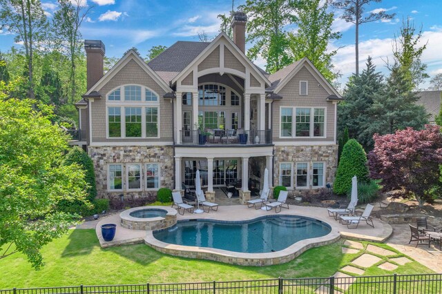 1071 Palmers Vw, Greensboro, GA 30642 - rear view of property with a chimney, a balcony, an in ground hot tub, a patio, and stone siding