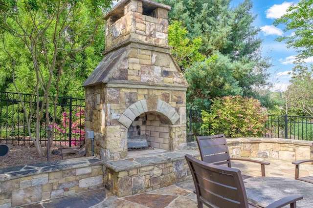 1071 Palmers Vw, Greensboro, GA 30642 - view of patio / terrace featuring an outdoor stone fireplace and fence