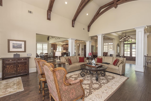 1071 Palmers Vw, Greensboro, GA 30642 - living area with a chandelier, high vaulted ceiling, visible vents, and ornate columns