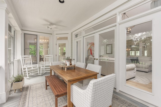 1040 Kimbrough Hill Ln, Greensboro, GA 30642 - sunroom with french doors, wood finished floors, and a chandelier