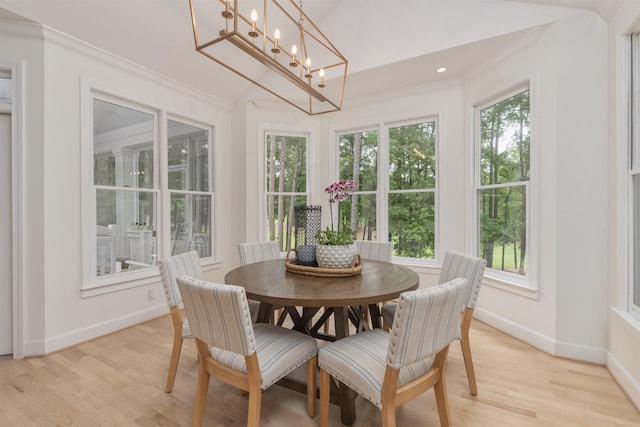1040 Kimbrough Hill Ln, Greensboro, GA 30642 - dining space with baseboards, light wood-type flooring, crown molding, a chandelier, and recessed lighting