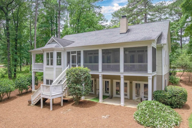 1040 Kimbrough Hill Ln, Greensboro, GA 30642 - back of house featuring a sunroom, a chimney, stairs, a patio, and roof with shingles