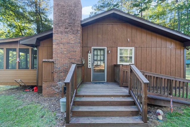 property entrance featuring a chimney