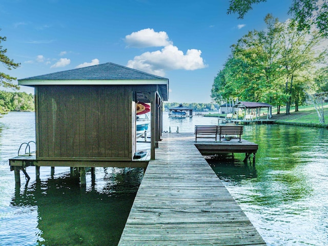 view of dock featuring a water view and boat lift