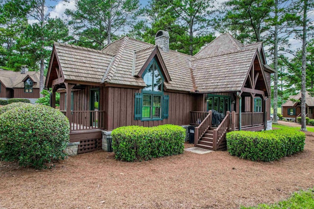125 Secoffee Dr, Eatonton, GA 31024 - view of front of home with board and batten siding and a chimney