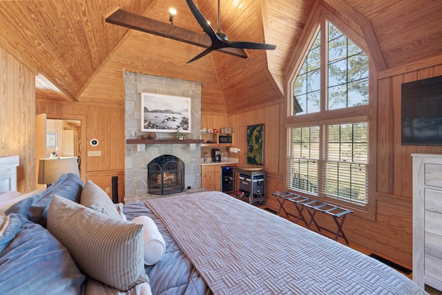 125 Secoffee Dr, Eatonton, GA 31024 - bedroom with wooden ceiling, wooden walls, a fireplace, and multiple windows
