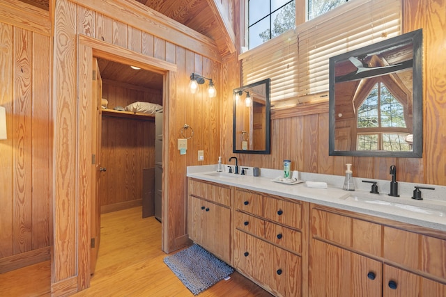 125 Secoffee Dr, Eatonton, GA 31024 - bathroom with wood walls, a sink, and wood finished floors