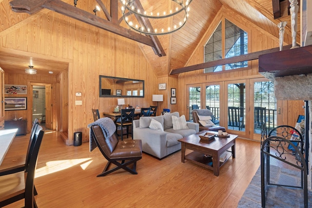 125 Secoffee Dr, Eatonton, GA 31024 - living room with wooden walls, wooden ceiling, beamed ceiling, wood finished floors, and a chandelier