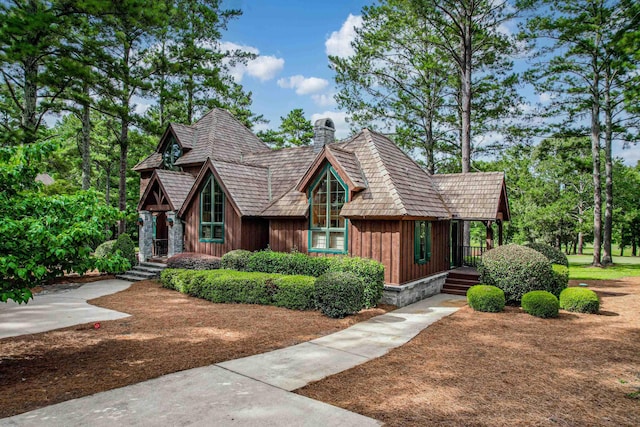 125 Secoffee Dr, Eatonton, GA 31024 - view of front of house with board and batten siding and a chimney